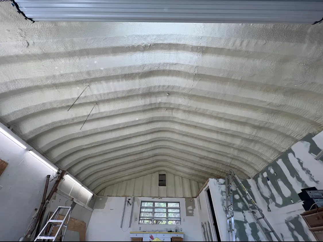 Spray polyurethane foam applied to the underside of a metal roof deck in Stansbury Park